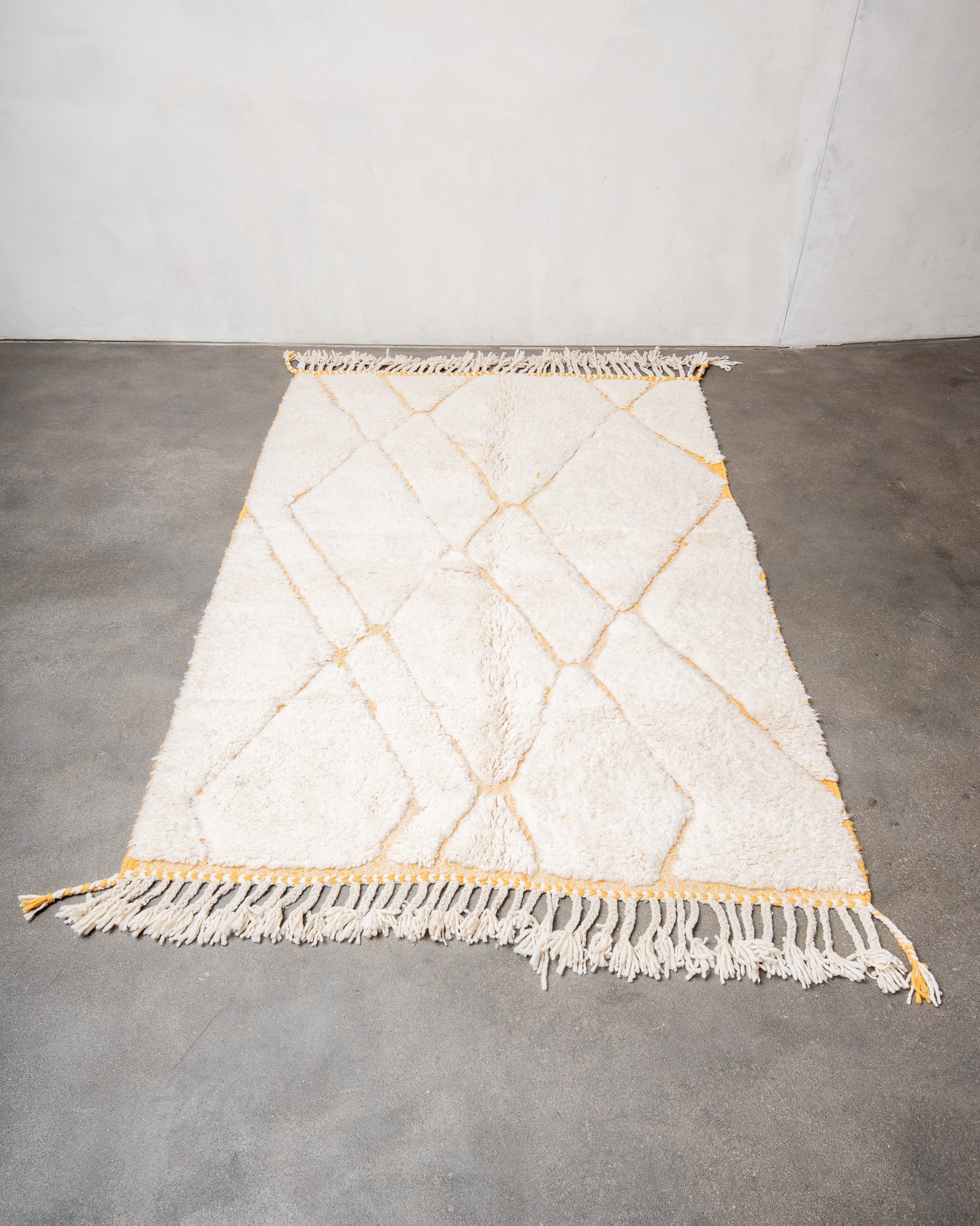 Modern, designer, handcrafted Berber rug from Morocco. Beniourain carpet with beautiful colours and patterns and fluffy wool texture.